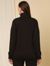 Back view of fleece maternity sweatshirt in black with high neck and full sleeves