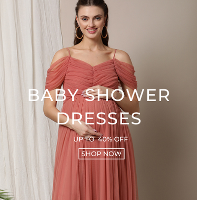 Pregnant woman wearing baby shower dress in pink