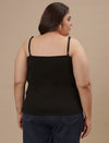 Plus-size woman in back view wearing Black Plus Size Camisole with adjustable straps and smooth back design