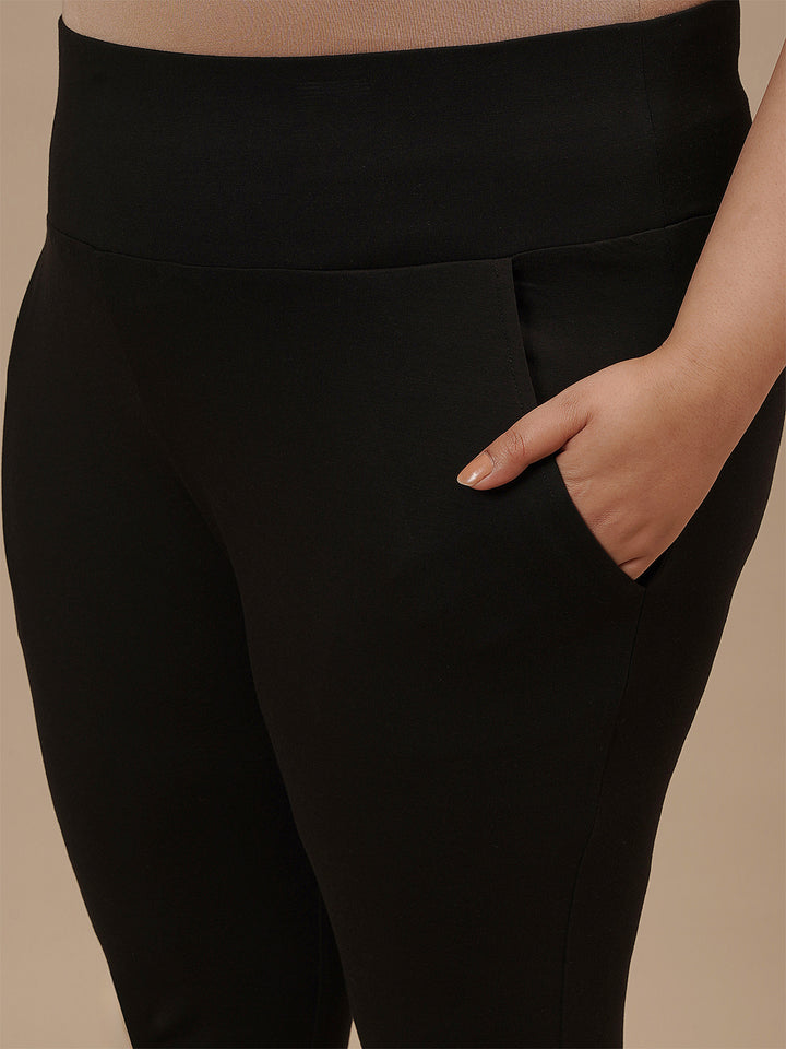 Close-up view of Black Plus Size Capri Pants showing waistband and stretch fabric detail