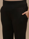 Close-up view of Black Plus Size Flare Pants showing waistband detail and smooth stretch fabric