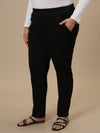 Plus-size woman in front left angle view wearing Black Plus Size Jeggings with high-rise waist and slim fit design