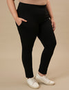 Plus-size woman in right side view wearing Black Plus Size Leggings With Pockets featuring high-rise waist and side pockets