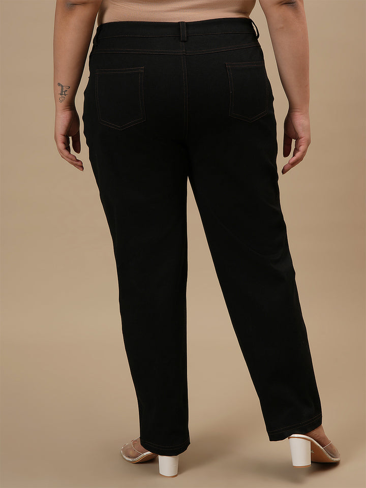 Plus-size woman in back view wearing Black Plus Size Straight Fit Jeans with mid-rise waist and straight leg design