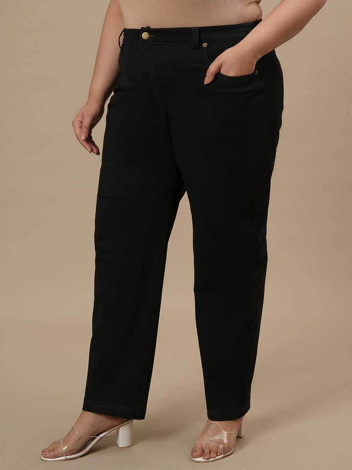 Plus-size woman in left side view wearing Black Plus Size Straight Fit Jeans with mid-rise waist and straight leg design