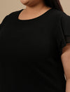 Close-up view of Black Plus Size Stretchy Top showing stretch fabric texture and neckline detail