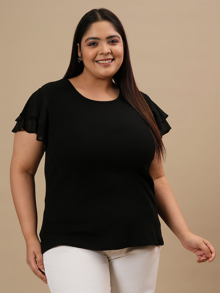 Plus-size woman in front angle view wearing Black Plus Size Stretchy Top with fitted silhouette and short sleeves