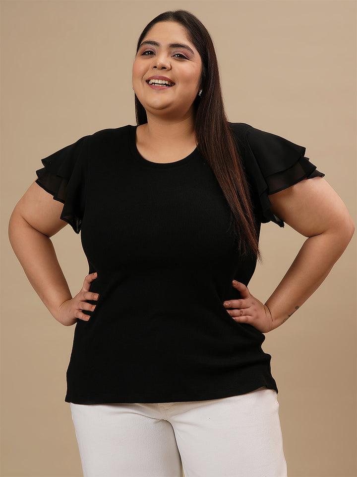 Plus-size woman in front view smiling while wearing Black Plus Size Stretchy Top with soft stretch fabric and short sleeves