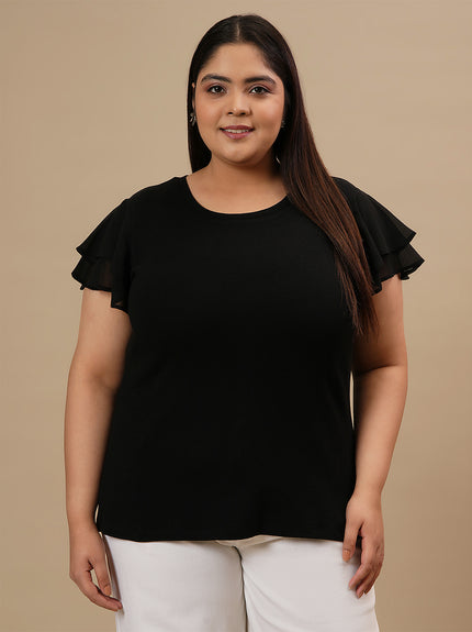 Plus-size woman in front view wearing Black Plus Size Stretchy Top featuring scoop neckline and body-hugging fit