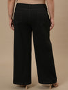 Plus-size woman in back view wearing Black Plus Size Wide Leg Jeans with classic back and relaxed silhouette