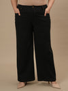 Plus-size woman in style shoot wearing Black Plus Size Wide Leg Jeans with structured fit and soft fabric