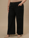 Plus-size woman in left side view wearing Black Plus Size Wide Leg Jeans with high-rise waist and flowy leg cut