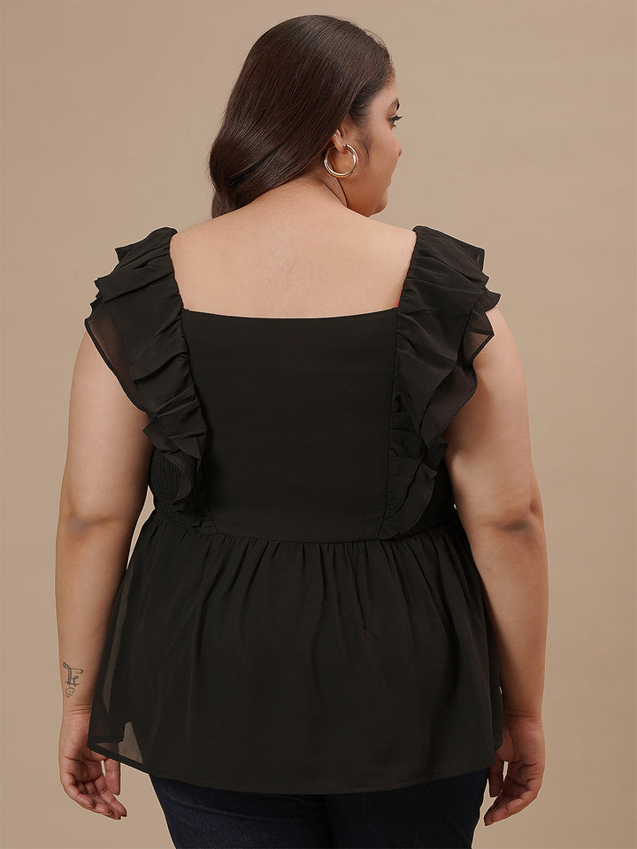 Plus-size woman in back side view wearing Black Sleeveless Plus Size Peplum Top with flared hem and fitted waist