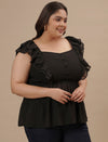 Plus-size woman in right side view wearing Black Sleeveless Plus Size Peplum Top with defined waist and flared bottom