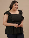 Plus-size woman in right side view wearing Black Sleeveless Plus Size Peplum Top with defined waist and flared bottom