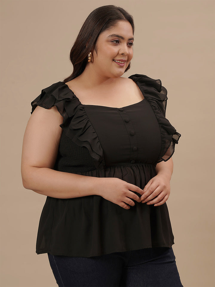 Plus-size woman in right side view wearing Black Sleeveless Plus Size Peplum Top with defined waist and flared bottom