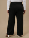 Plus-size woman in back view wearing Black Wide Leg Plus Size Pants with smooth back and wide-leg cut