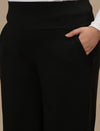 Close-up view of Black Wide Leg Plus Size Pants showing elastic waistband and soft, breathable fabric