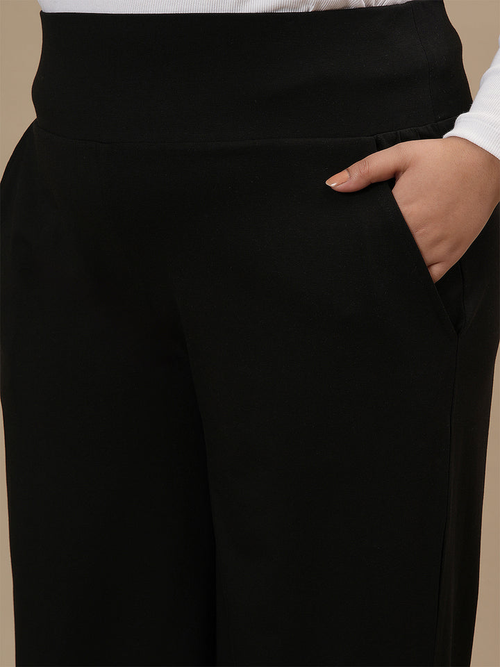 Close-up view of Black Wide Leg Plus Size Pants showing elastic waistband and soft, breathable fabric