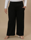 Plus-size woman in front view wearing Black Wide Leg Plus Size Pants with full-length wide leg and high-rise waist
