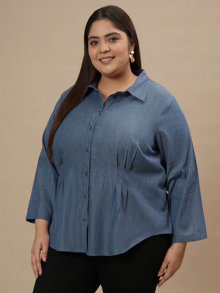 Plus-size woman in front left angle view wearing Plus Size Blue Denim Shirt with full sleeves and button-down front