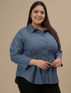 Plus-size woman in front right angle view wearing Plus Size Blue Denim Shirt with full sleeves and button-down front