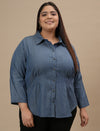 Plus-size woman in angled front view wearing Plus Size Blue Denim Shirt with full sleeves and button-down front