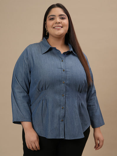 Plus-size woman in angled front view wearing Plus Size Blue Denim Shirt with full sleeves and button-down front