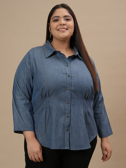 Plus-size woman in angled front view wearing Plus Size Blue Denim Shirt with full sleeves and button-down front