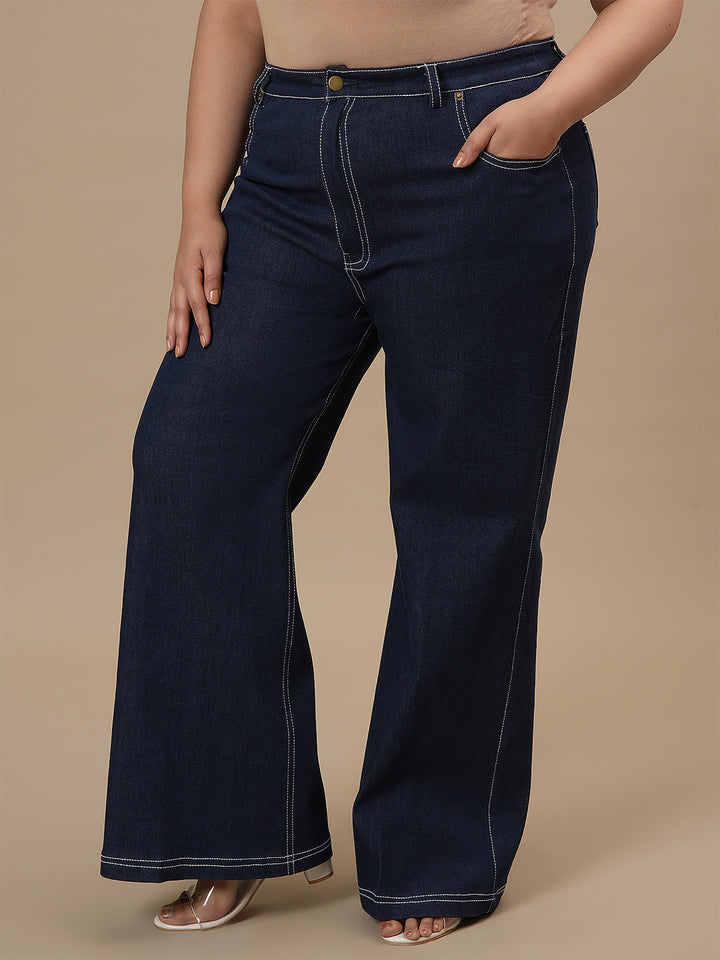 Plus-size woman in front left angle view wearing Blue Plus Size Bootcut Jeans with slim thigh and flared bottom