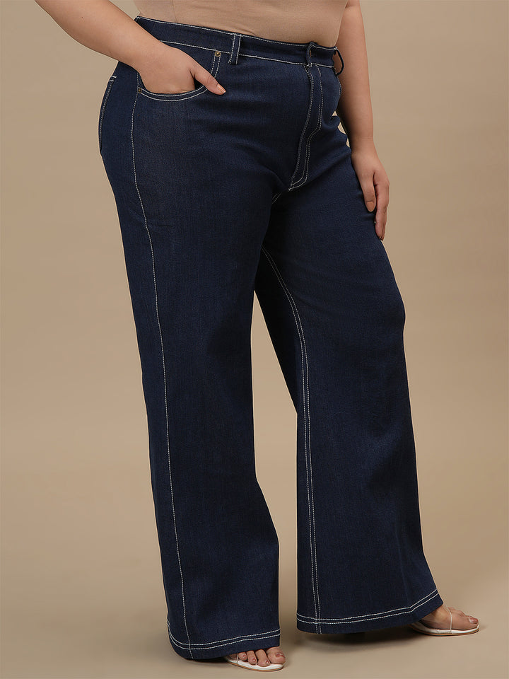 Plus-size woman in front right angle view wearing Blue Plus Size Bootcut Jeans with classic fit and flared hem