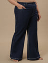 Plus-size woman in right side view wearing Blue Plus Size Bootcut Jeans with high waist and flared hem
