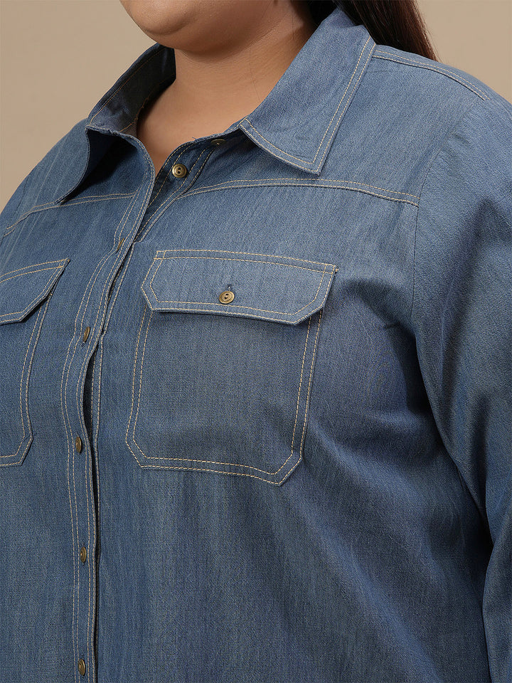 Close-up view of Blue Plus Size Denim Shirt showing button-front closure and denim texture