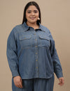 Plus-size woman in front view wearing Blue Plus Size Denim Shirt with chest pockets and structured collar