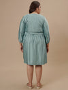 Plus-size woman in back view wearing Blue Plus Size Satin Dress with clean finish and flowy back design