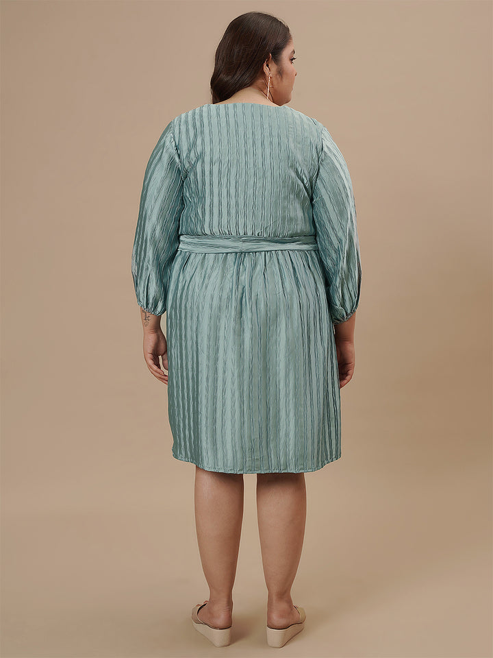 Plus-size woman in back view wearing Blue Plus Size Satin Dress with clean finish and flowy back design