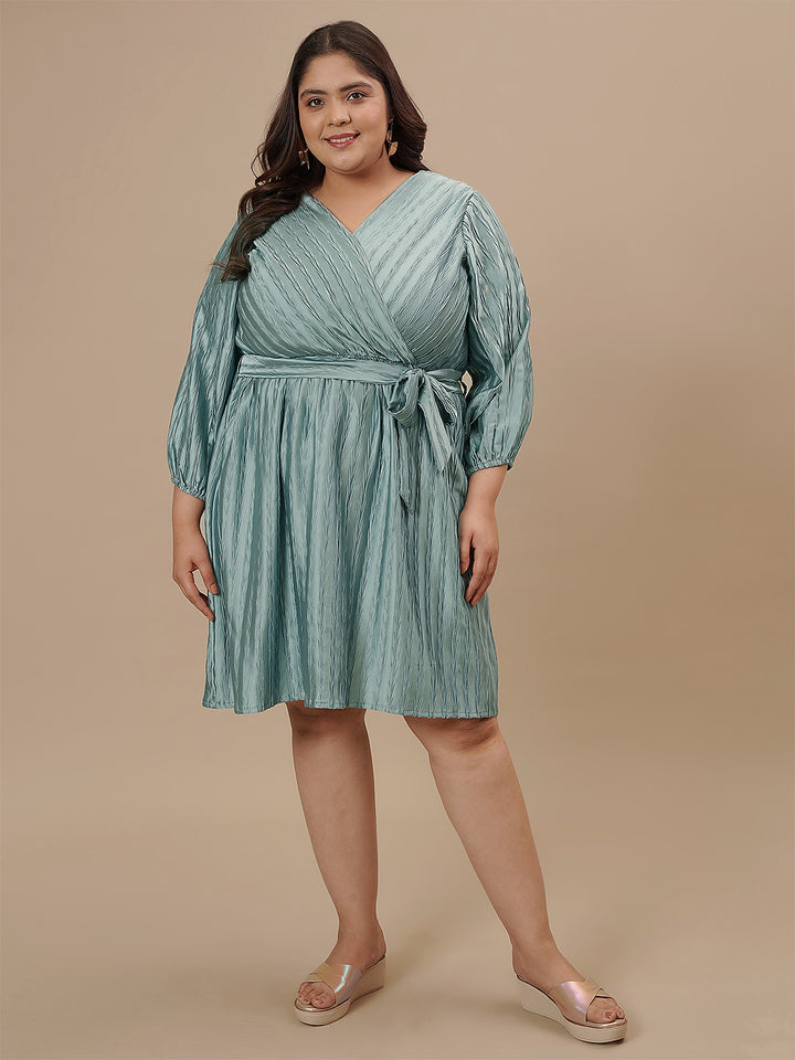 Plus-size woman in front-facing view wearing Blue Plus Size Satin Dress with sleeveless design and soft shine
