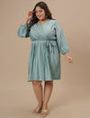 Plus-size woman in styled shoot wearing Blue Plus Size Satin Dress featuring smooth satin fabric and relaxed fit