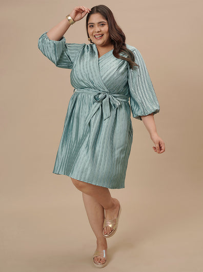 Plus-size woman in front pose wearing Blue Plus Size Satin Dress with V-neckline and elegant satin sheen