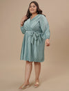 Plus-size woman in left side view wearing Blue Plus Size Satin Dress with flowy fit and soft satin texture