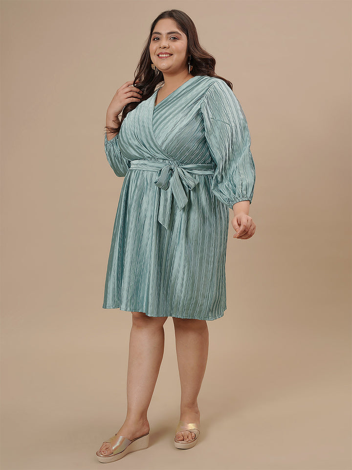 Plus-size woman in left side view wearing Blue Plus Size Satin Dress with flowy fit and soft satin texture