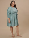 Plus-size woman in right side view wearing Blue Plus Size Satin Dress with glossy finish and flattering drape
