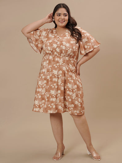 Playful pose with model's hand on head, highlighting front view and flutter sleeves.