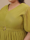 Close-up view of Green Pleated Plus Size Formal Dress showing pleated detail and soft satin-like fabric