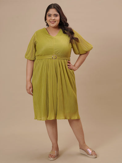 Plus-size woman in front view wearing Green Pleated Plus Size Formal Dress with V-neck and flowy pleated skirt