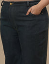 Close-up view of Green Plus Size Bootcut Jeans showing waistband and smooth denim texture