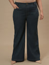 Plus-size woman in front view wearing Green Plus Size Bootcut Jeans featuring clean lines and bootcut fit