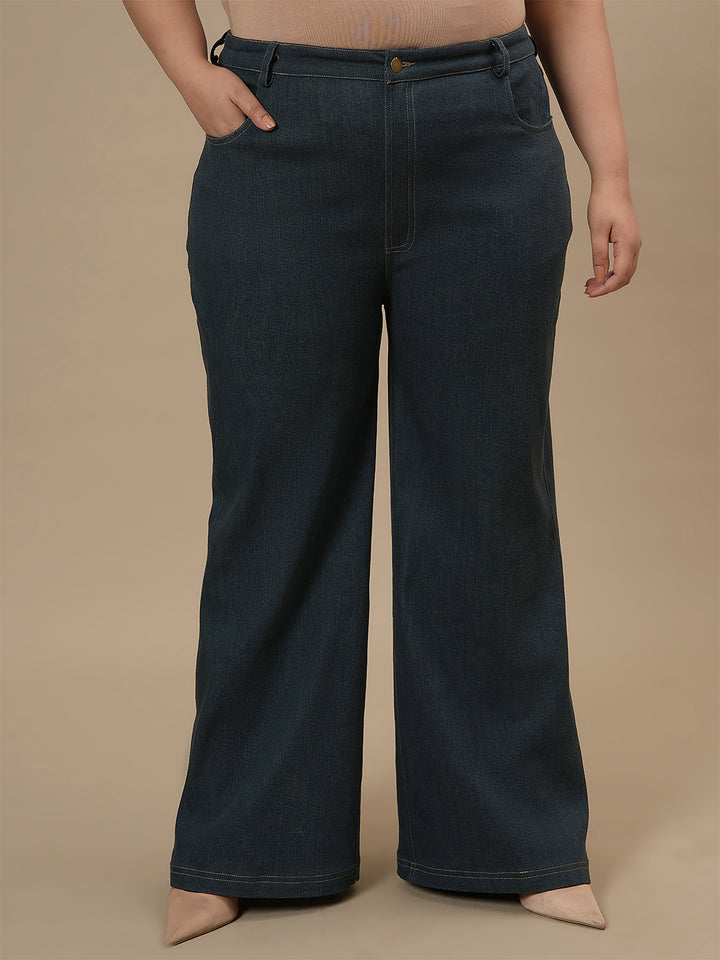 Plus-size woman in front view wearing Green Plus Size Bootcut Jeans featuring clean lines and bootcut fit