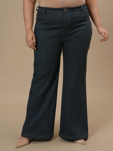Plus-size woman in front pose wearing Green Plus Size Bootcut Jeans featuring bootcut silhouette and structured fit