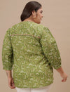 Plus-size woman in back view wearing Green Plus Size Floral Top with flowy silhouette and all-over floral print